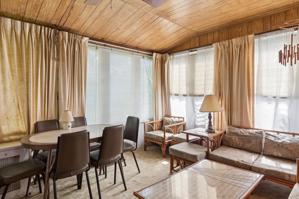 Wood-paneled sunroom at 50 Park Ave