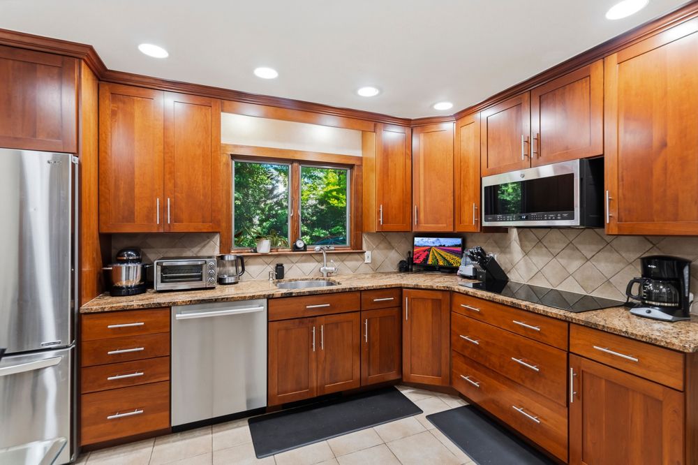 Eat-in kitchen with granite counters at 58 Ridge Dr. E